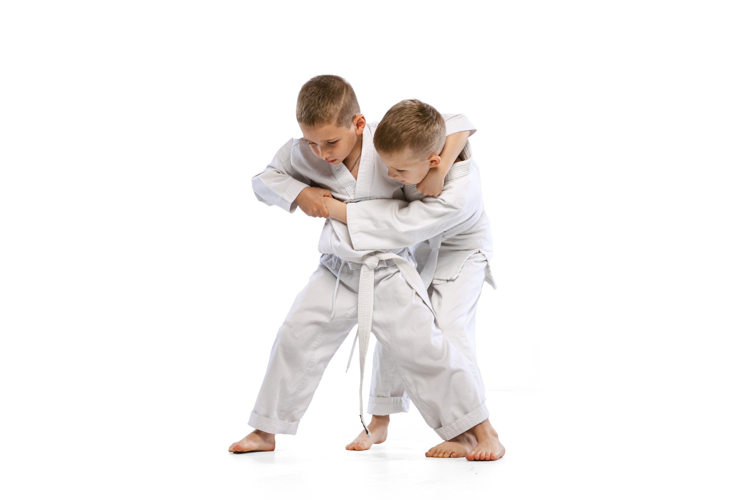 //mkk.mkkoyama.pl/wp-content/uploads/2023/09/two-boys-children-fighting-training-martial-sport-karate-isolated-white-studio-background-1-scaled.jpg